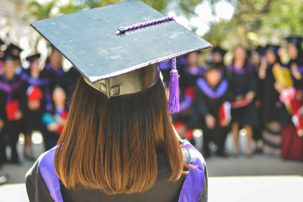 Postgraduate students celebrating graduation and higher education opportunities