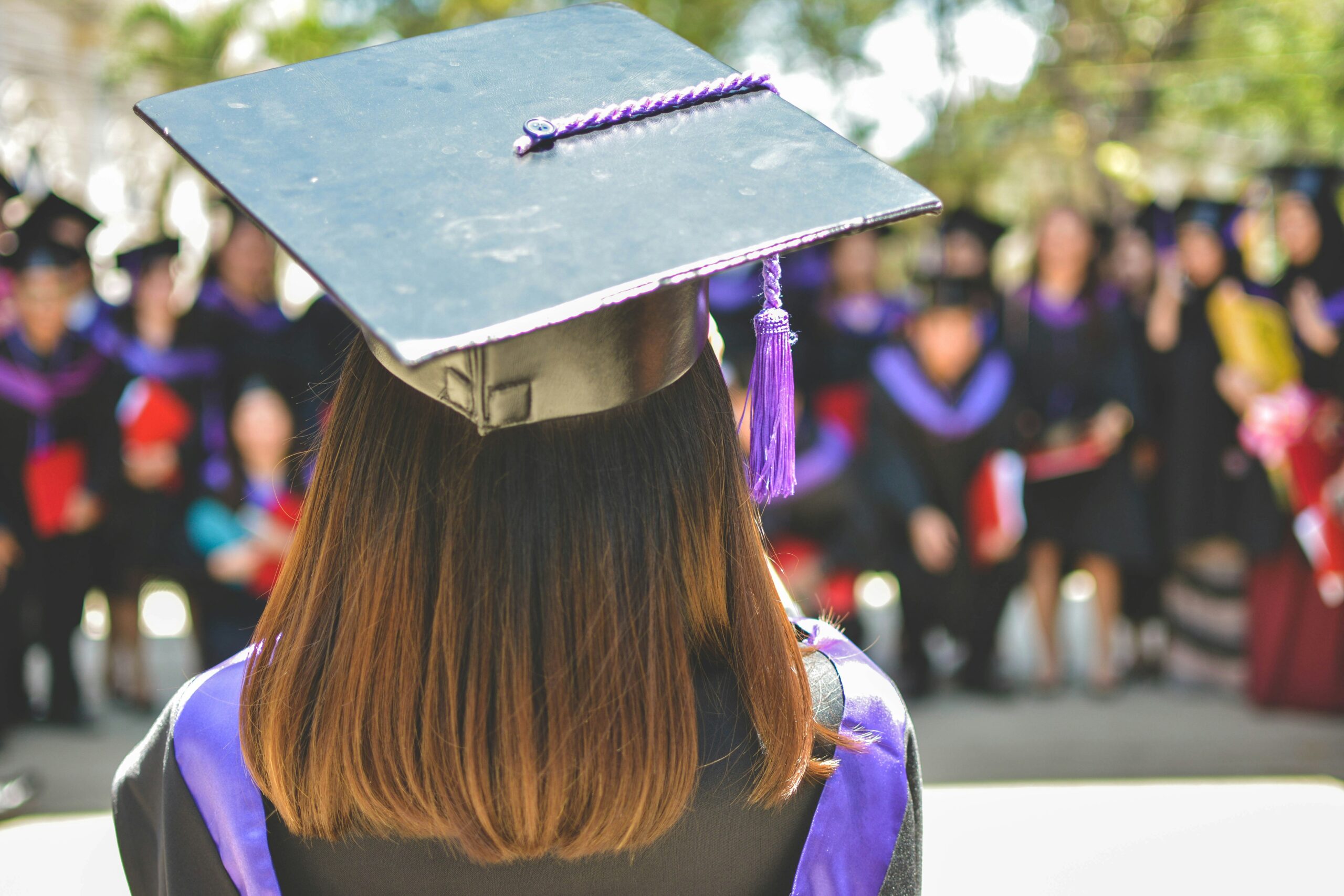 Postgraduate students celebrating graduation and higher education opportunities