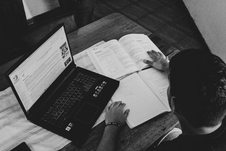 Engineering student preparing for a competitive examination with study material
